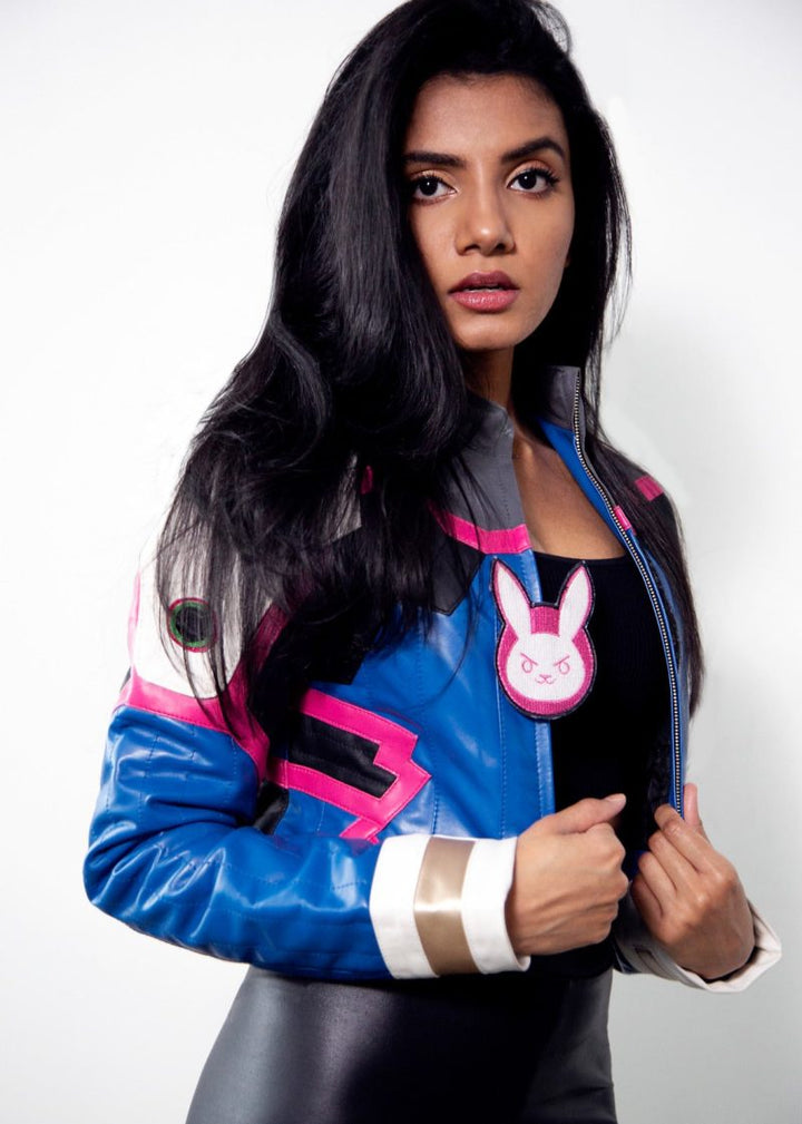 Woman wearing a colorful jacket with a bunny emblem on a white background