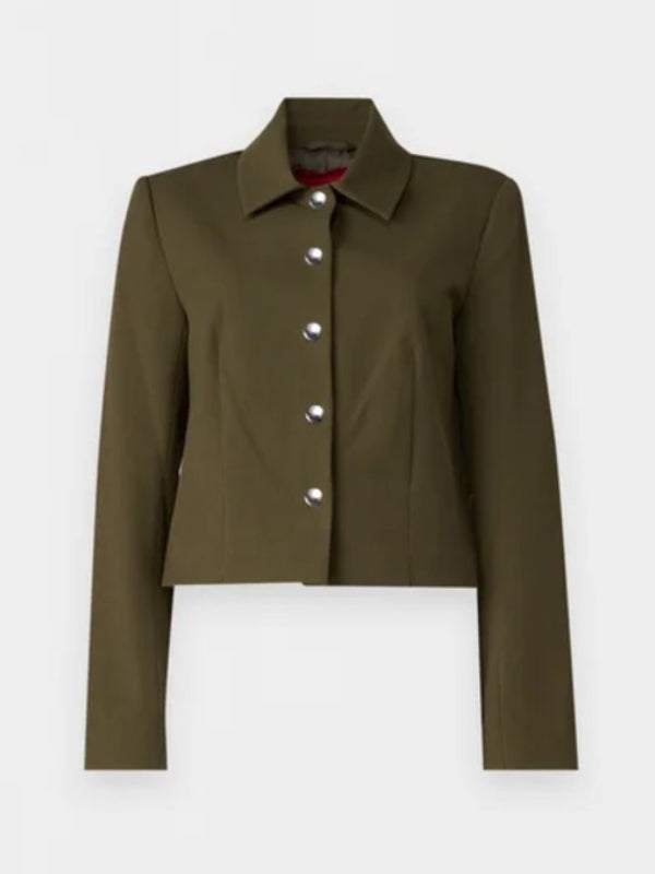 Stylish green jacket worn by Taylor Tomlinson in After Midnight 2024 in USA