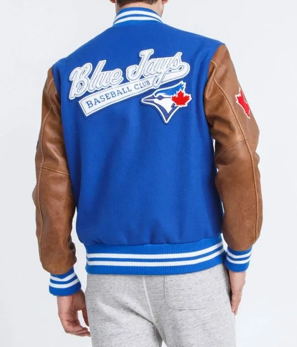 Blue Jays baseball club varsity jacket with brown leather sleeves on a white background in USA
