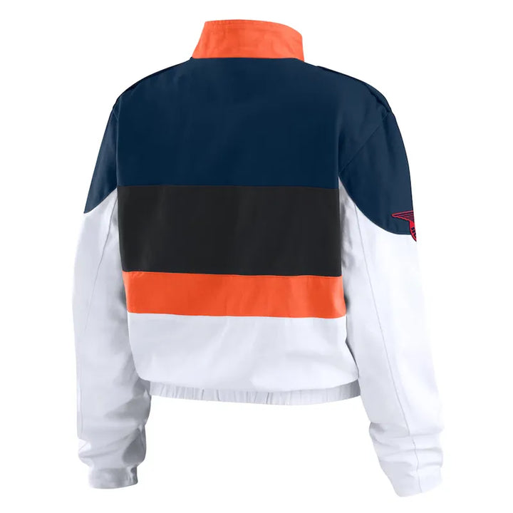 Color-blocked jacket with navy, orange, black, and white sections on a white background