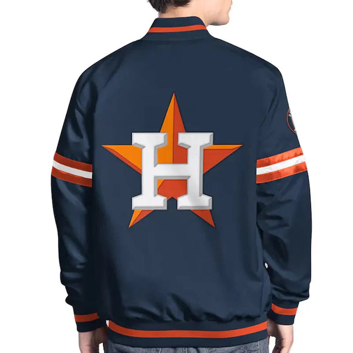Navy blue jacket with orange and white accents featuring a star and letter 'H' on the back, worn by a person.