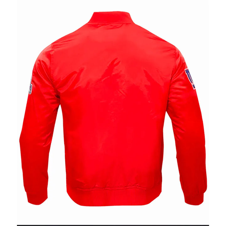 Red jacket with patches on the back and sleeves against a white background