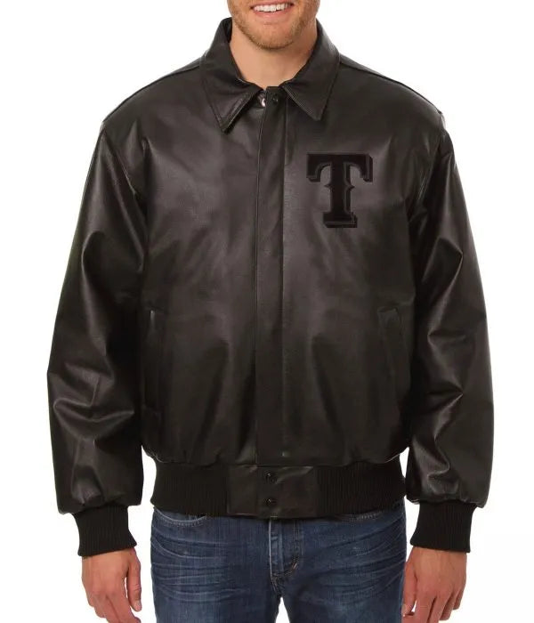 Man wearing a black leather jacket with a logo on a white background