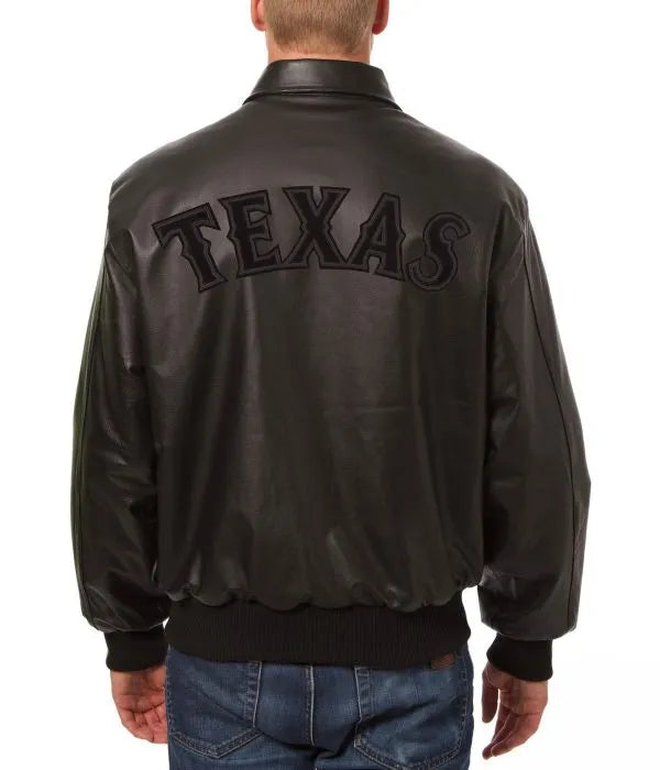 Black leather jacket with 'TEXAS' on the back, worn by a person.