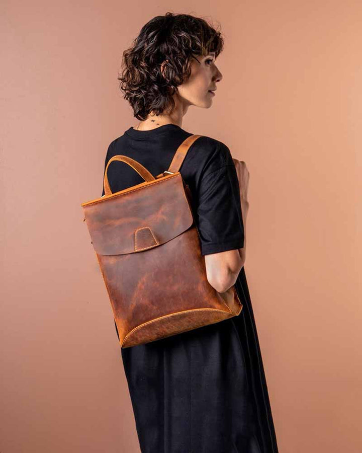Upgrade your accessory game with the Pricy Leather Slim Backpack in America