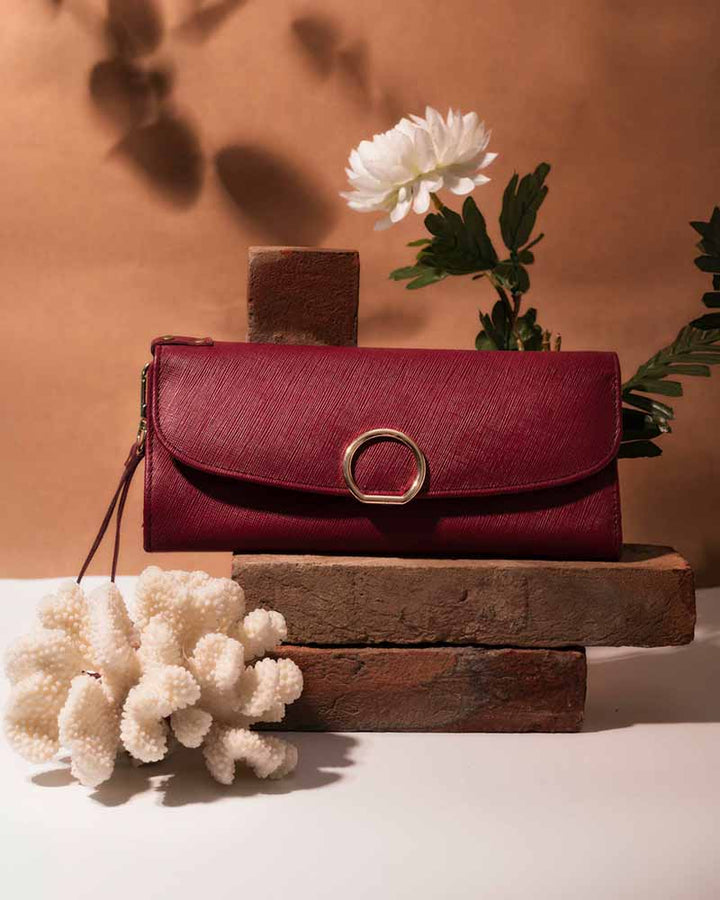 Wristlet clutch with decorative hardware in UK style