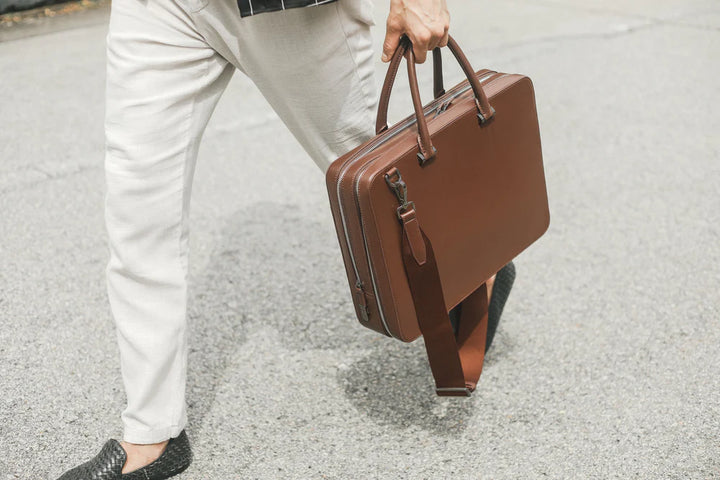 Brown leather briefcase with silver buckle