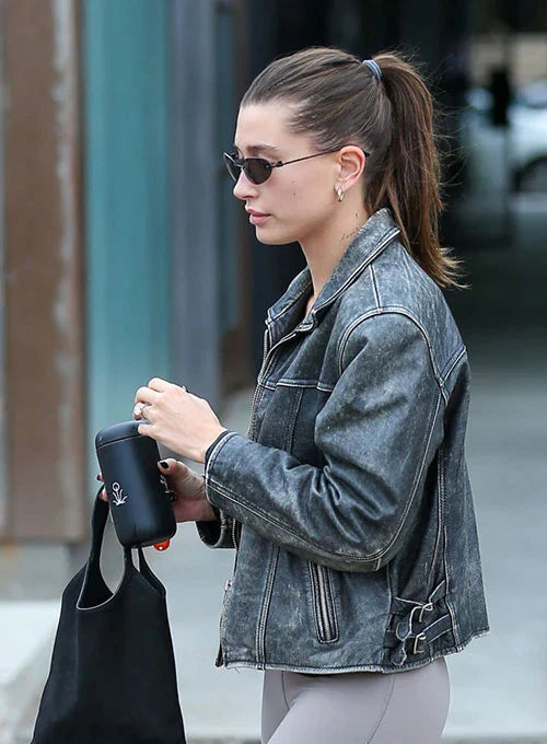 Hailey Baldwin Bieber's edgy outfit featuring a cropped leather jacket and skinny jeans in German style